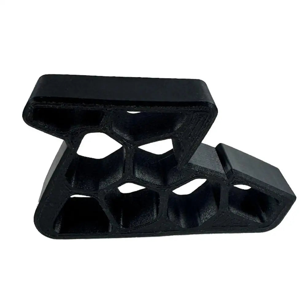 Black door stop wedge with track lock and anti-slip honeycomb grip pattern