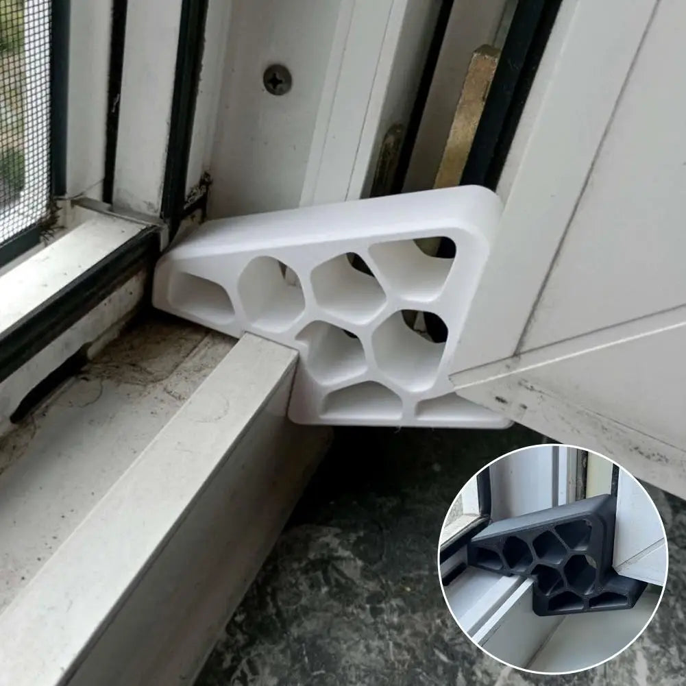 White window and balcony door stopper wedge installed at window/door sill