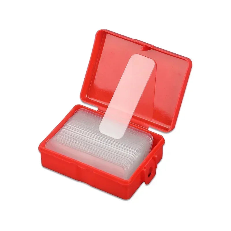 Double-sided adhesive mounting tape strips in open red storage case