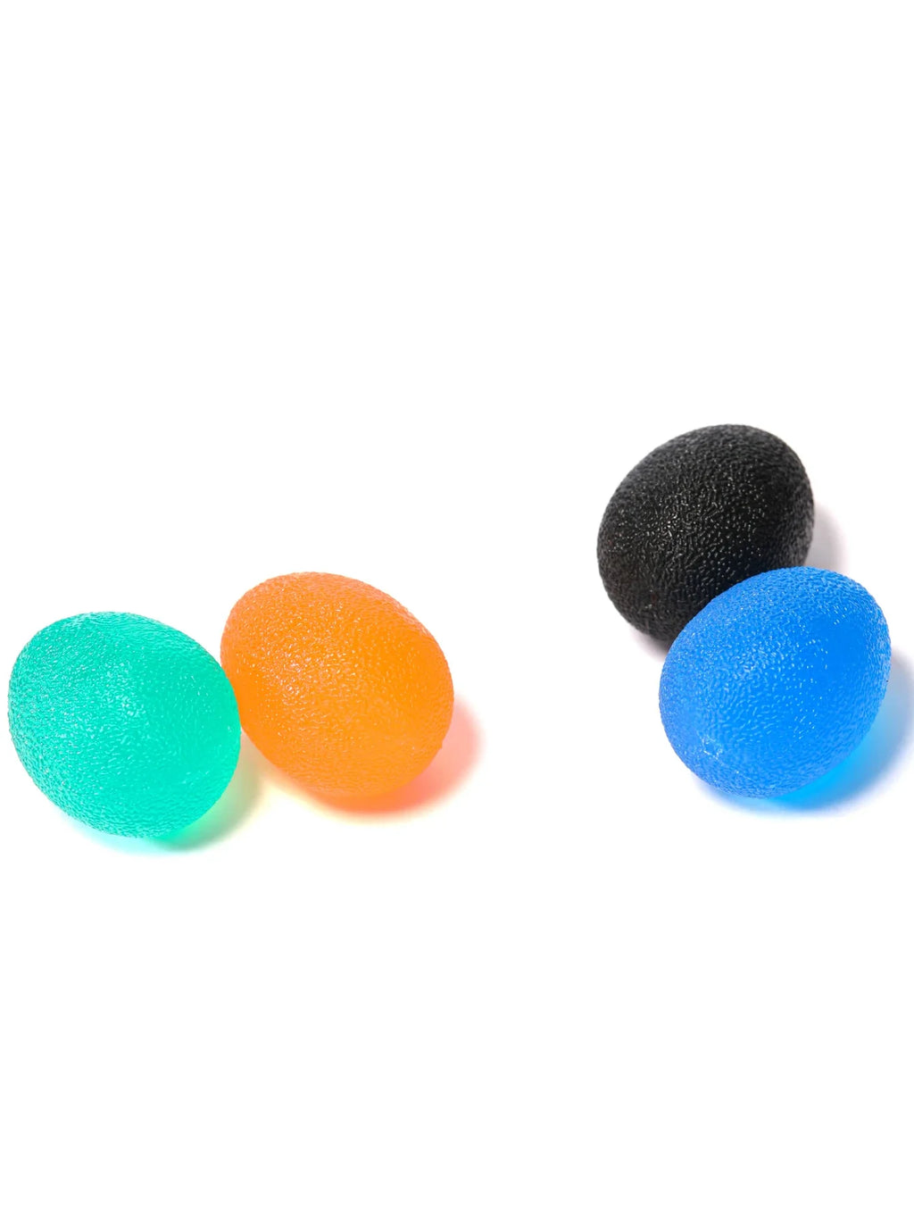 Four textured egg grip balls: mint green, orange, black, and blue.