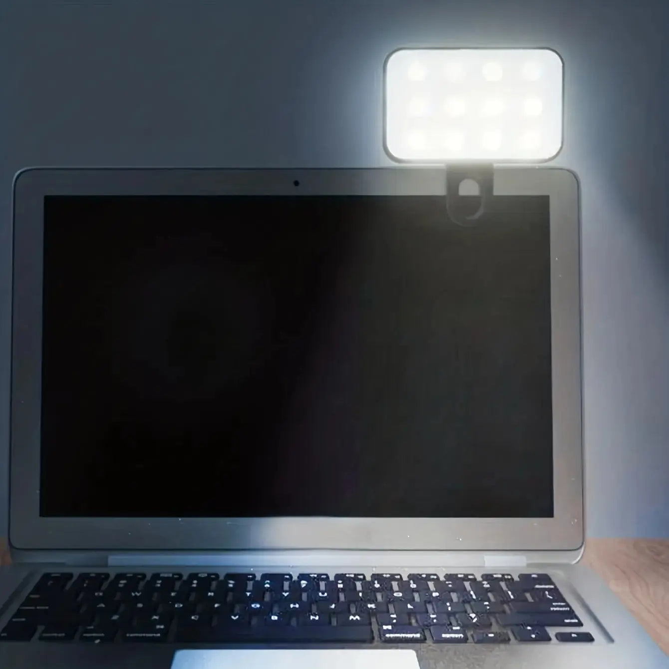 Clip-on LED fill light illuminating a tablet screen