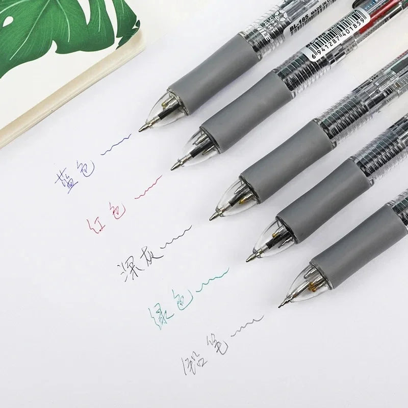 Six-piece pen set with grey barrels and metal tips, including multicolor ballpoints