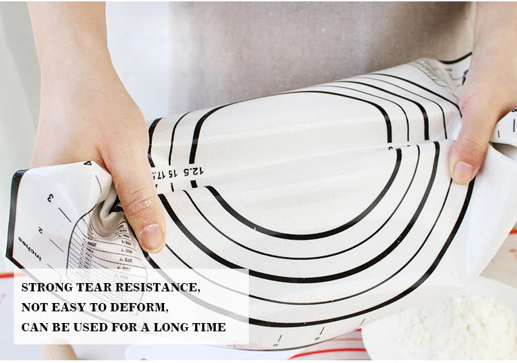 Silicone rolling dough mat with red rings and black-edge design, hands lifting