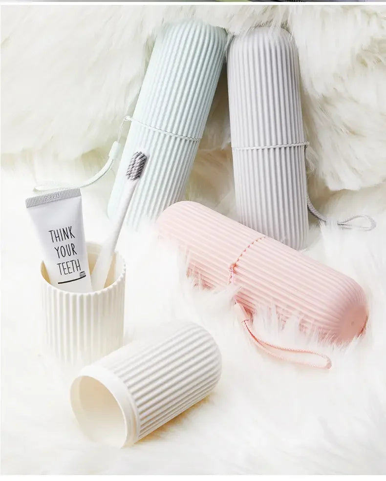 Ribbed toothbrush holder cases in pink and gray with toothbrushes stored inside