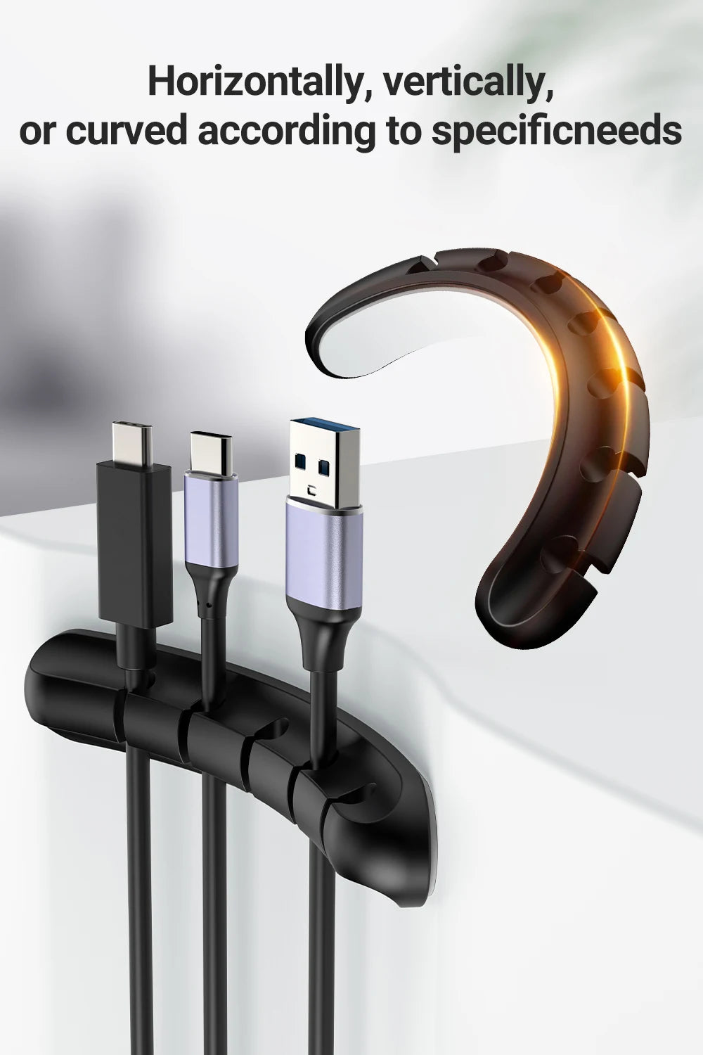 Black adhesive cable holder clips securing three cables in separate channels