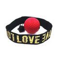 Red reflex punch ball on black headband with gold “I LOVE” lettering and tether