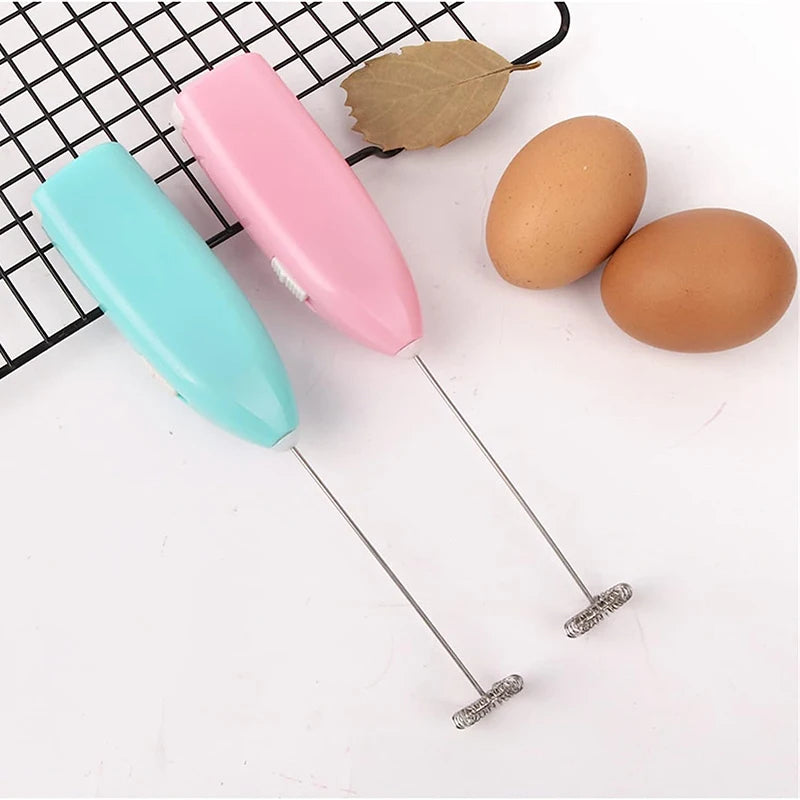 Pink and teal handheld milk frothers with wire whisk beaters