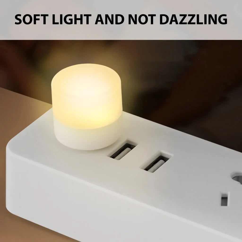 Mini round USB night light with warm yellow glow and multi-USB power base