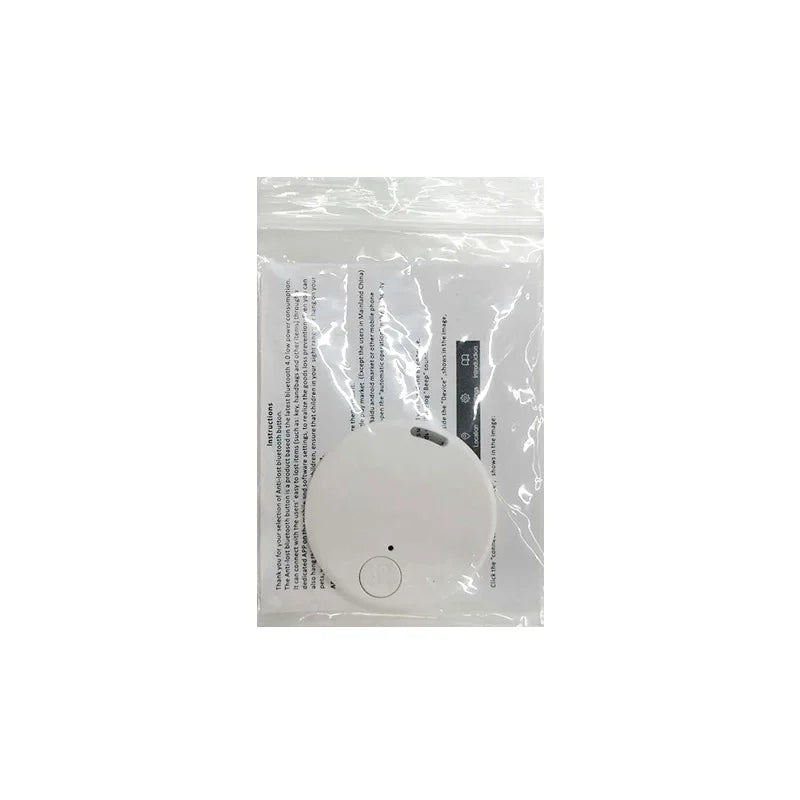 White round Bluetooth anti-lost alarm tracker sealed in clear plastic packaging