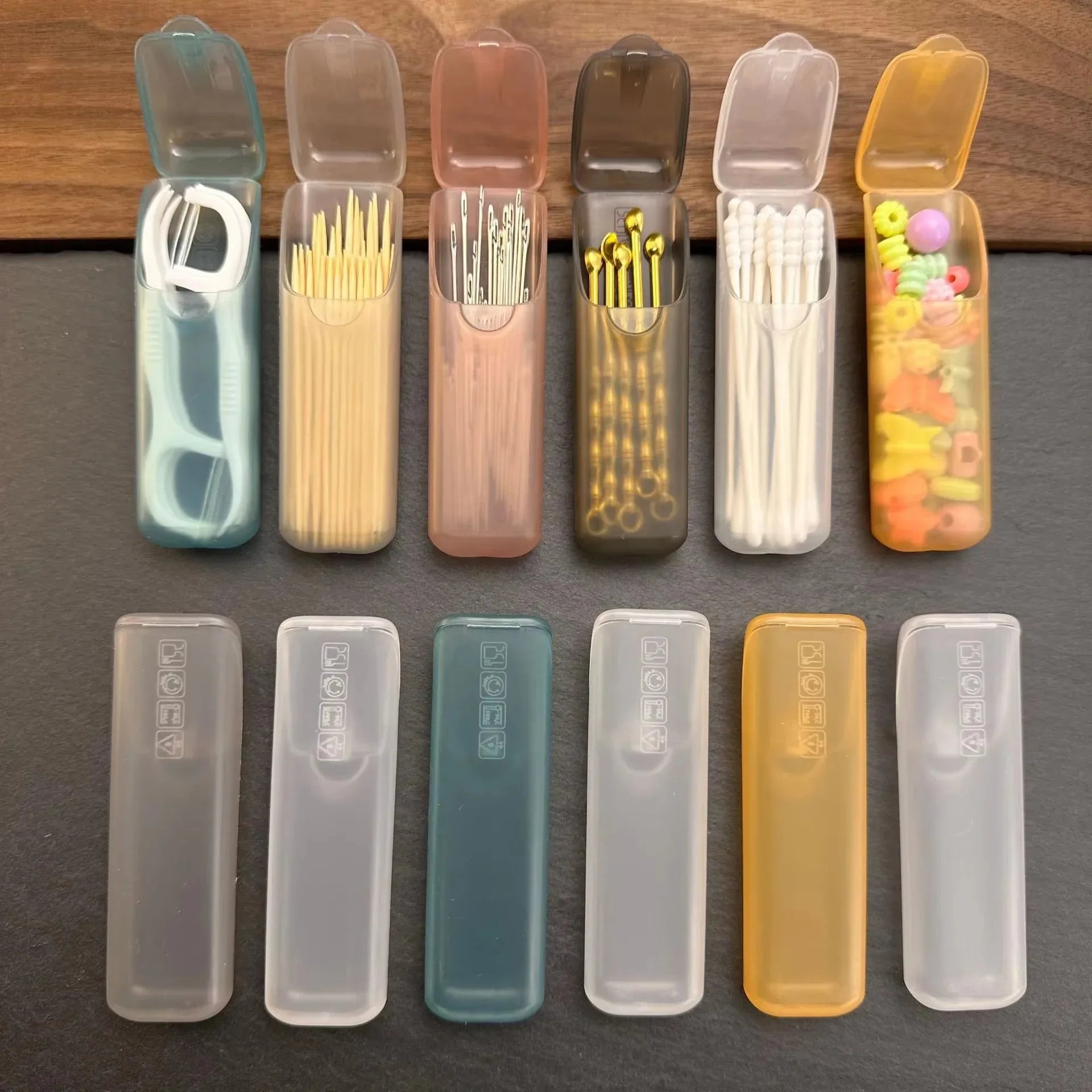 Mini portable storage box set with clear snap lids, holding toothpicks and cotton swabs