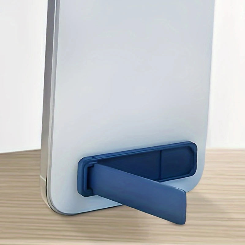 Blue ultra-thin phone bracket attached to a phone case, folded open for support