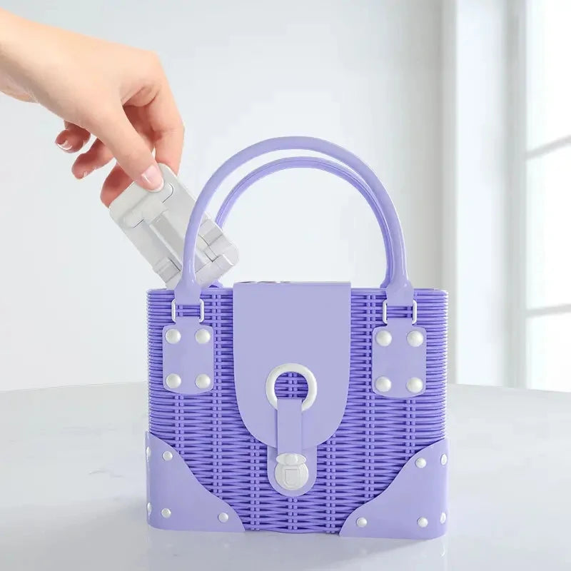 Purple woven mini tote bag with top handle and front clasp