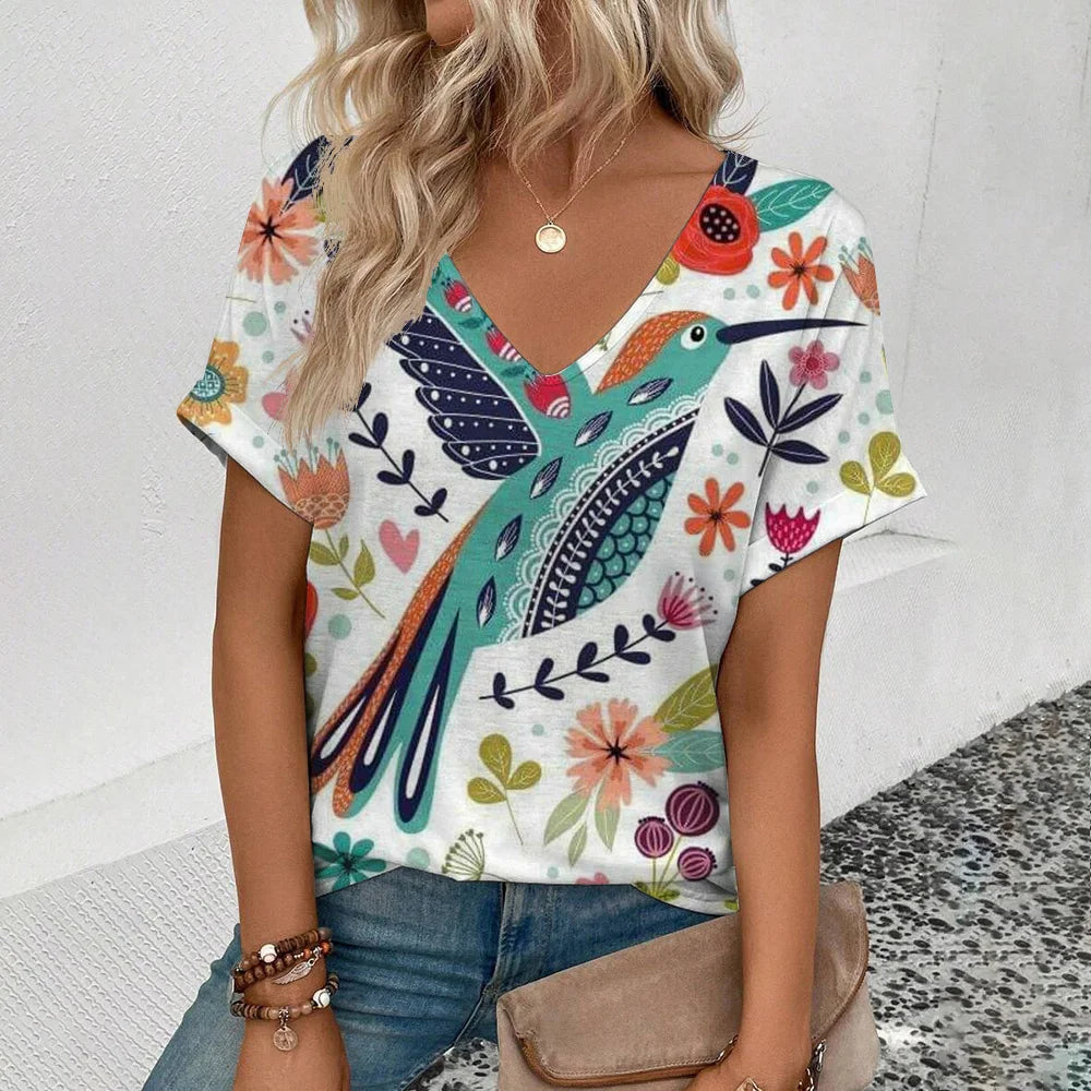 Women's plus-size V-neck T-shirt, white with colorful floral and leaf pattern.