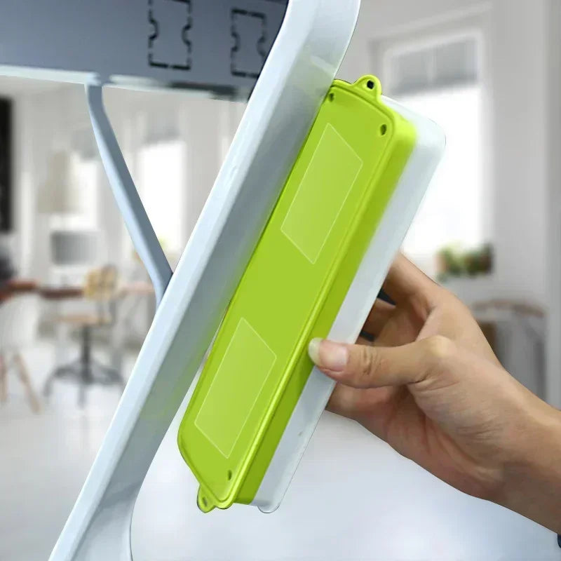 Clear adhesive strips securing a white device holder to a surface