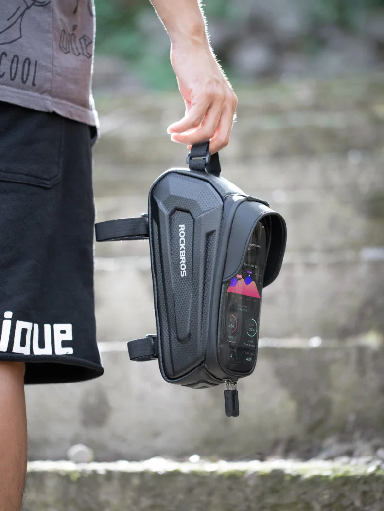 Gray waterproof bicycle phone bag clipped to a strap for carrying