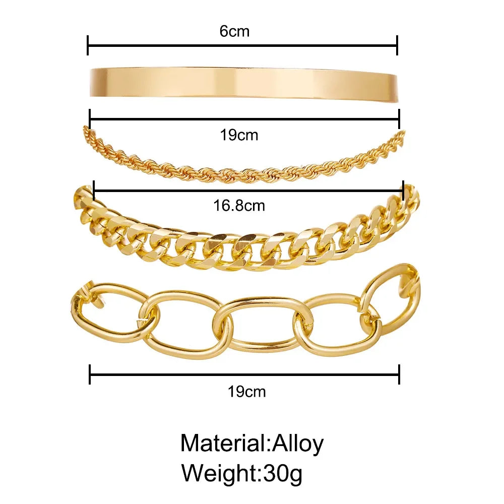 Gold-tone chain bracelet set with thick link open bangles, geometric accents, multiple cuffs
