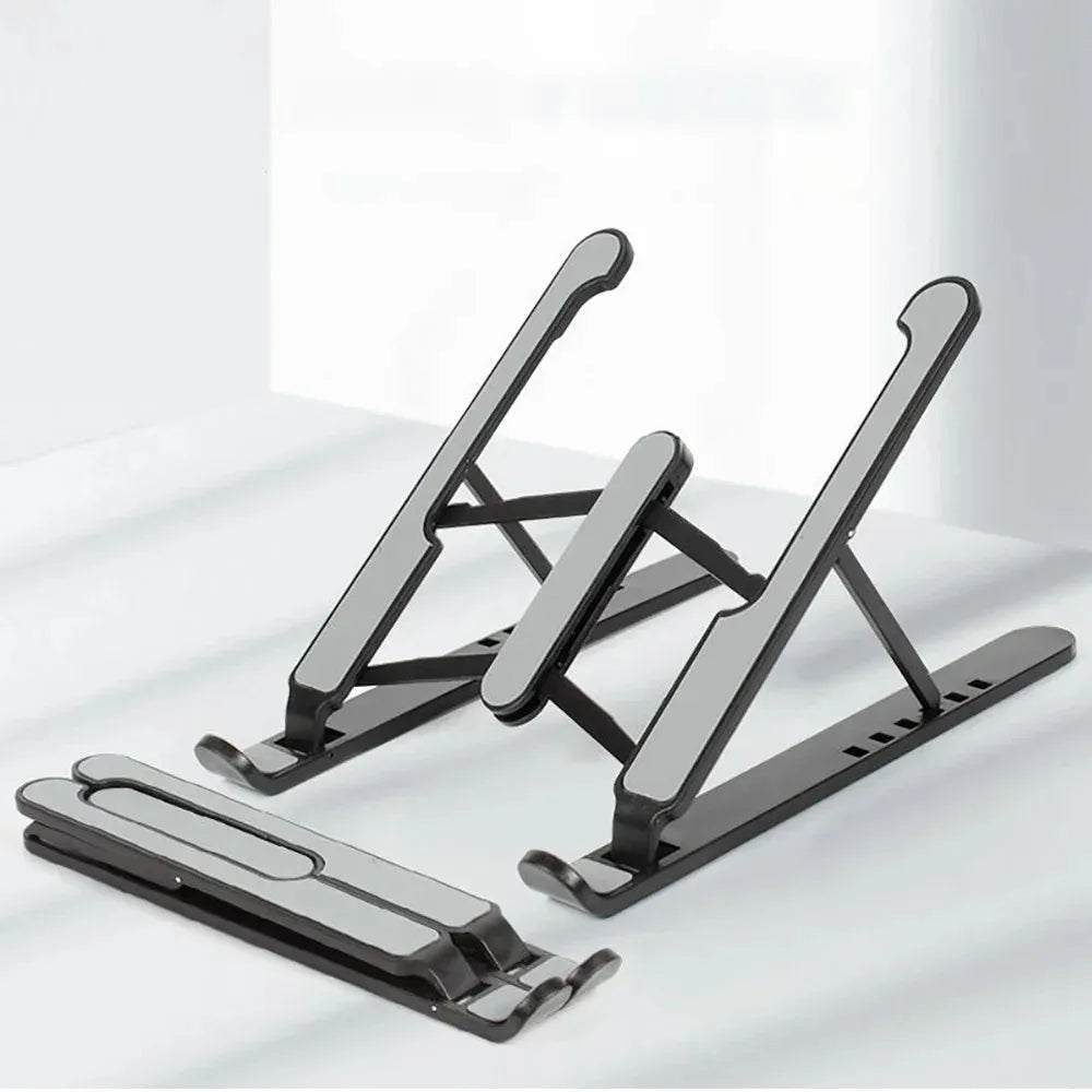 Foldable laptop stand with dark metal legs and grippy support pads