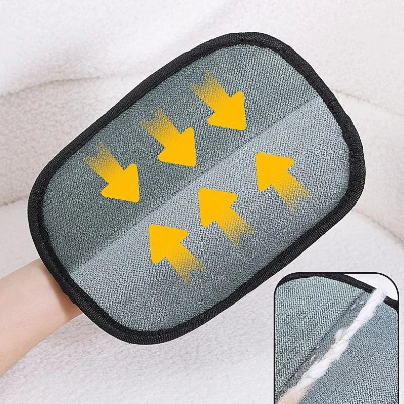 Gray lint-catching pad with yellow arrow pattern on pet hair remover glove