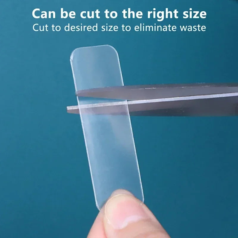 Clear adhesive strip tab being cut to size with scissors for minimal waste