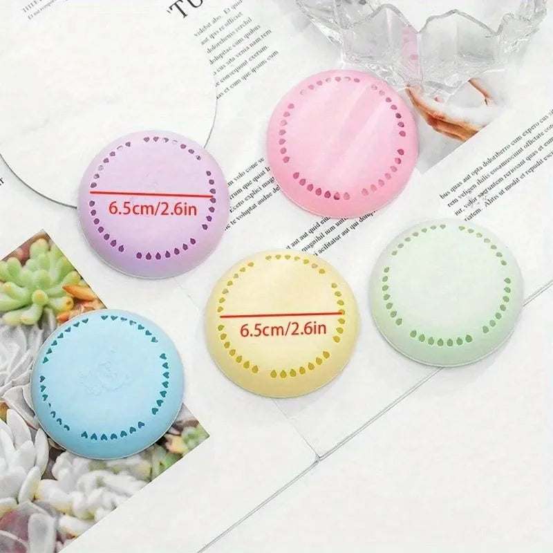 Assorted round aromatherapy deodorizing tablets in blue, purple, pink, yellow, and green