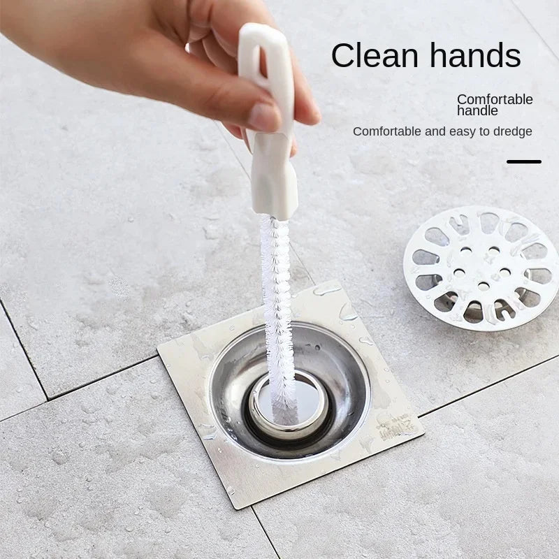 Flexible hair dredging brush with spiral bristles inserted into sink drain