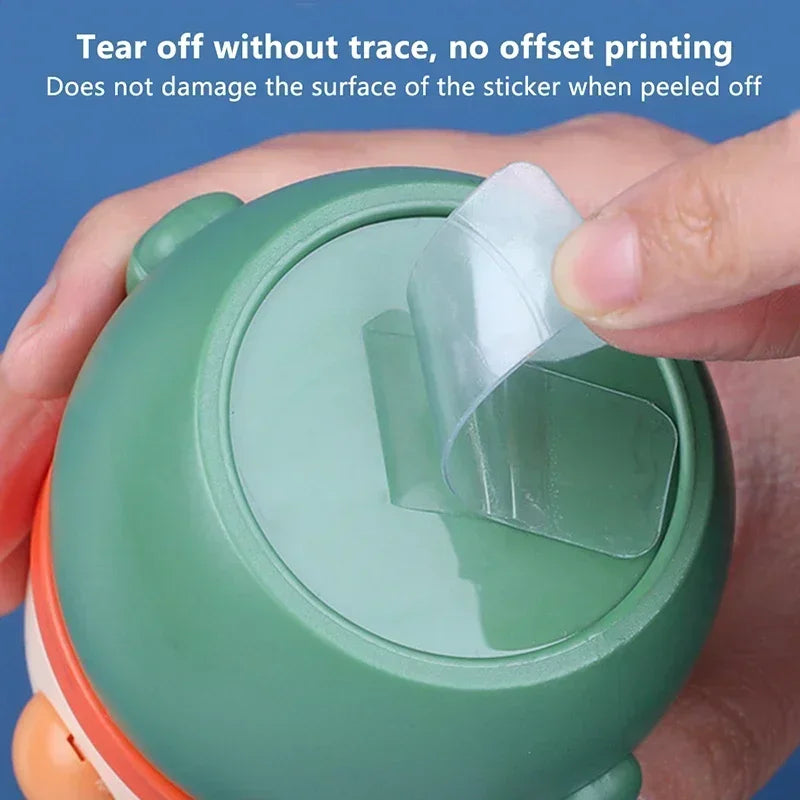 Transparent adhesive tape tab on a roll, hands lifting the release film
