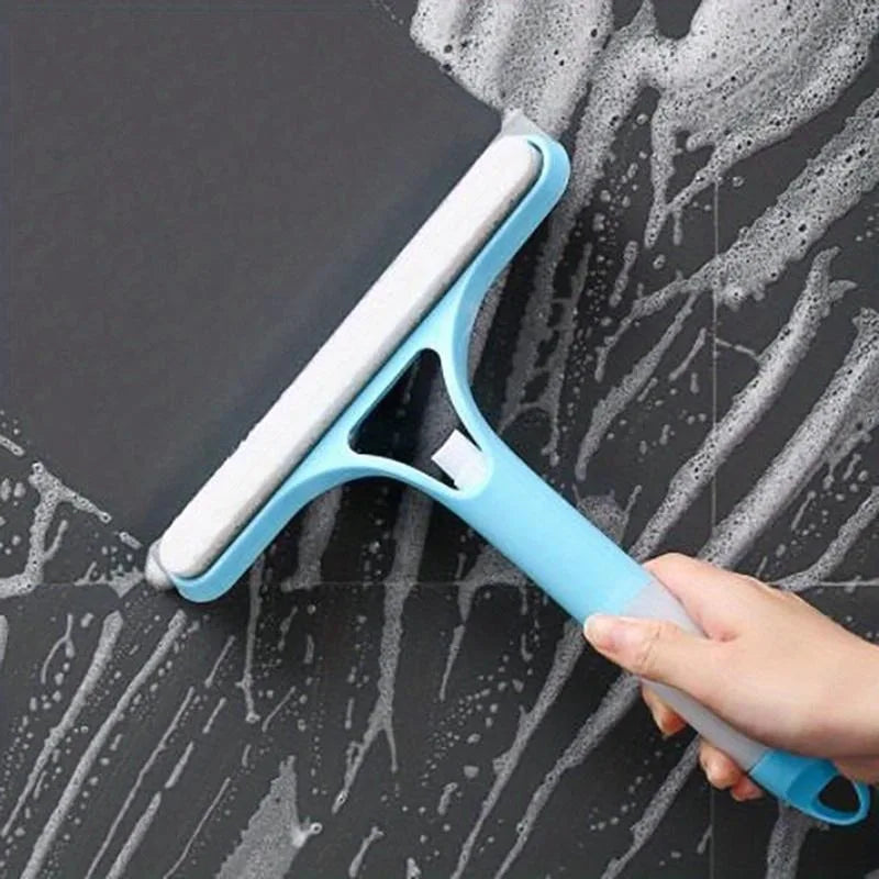 Blue and white window squeegee wiper with rubber blade, removing soapy water