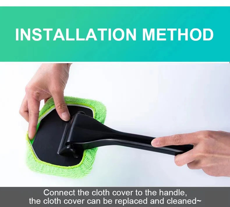 Car window cleaning brush with green microfiber pad attached to long black handle.