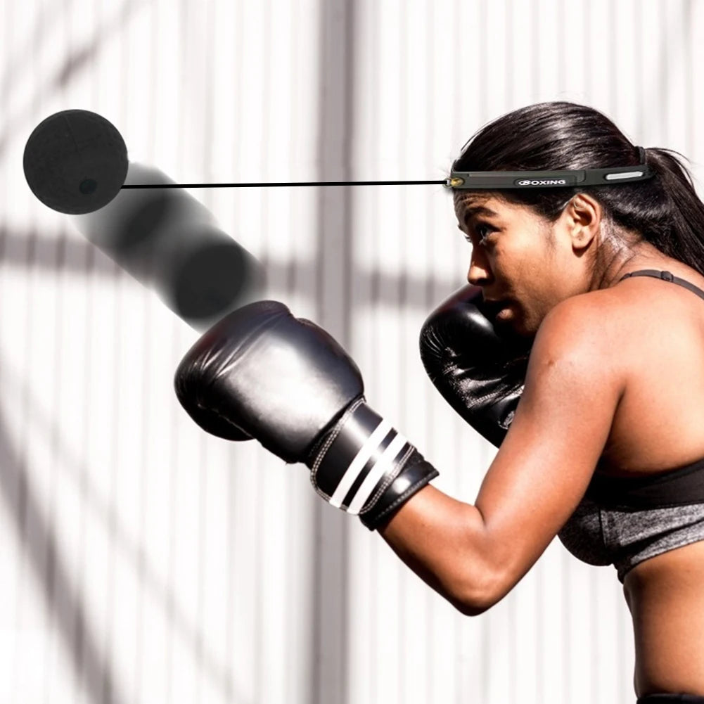 Boxing reflex speed punch ball set with black ball on cord and boxing gloves