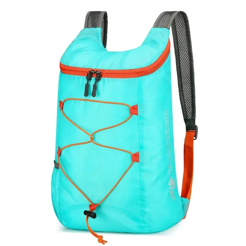 Turquoise folding backpack with orange trim, front bungee organizer and mesh back straps