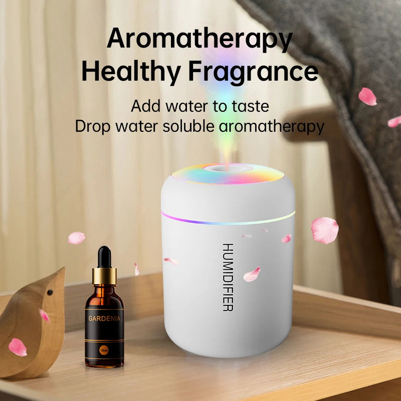 White aroma humidifier with rainbow LED top ring and visible water mist