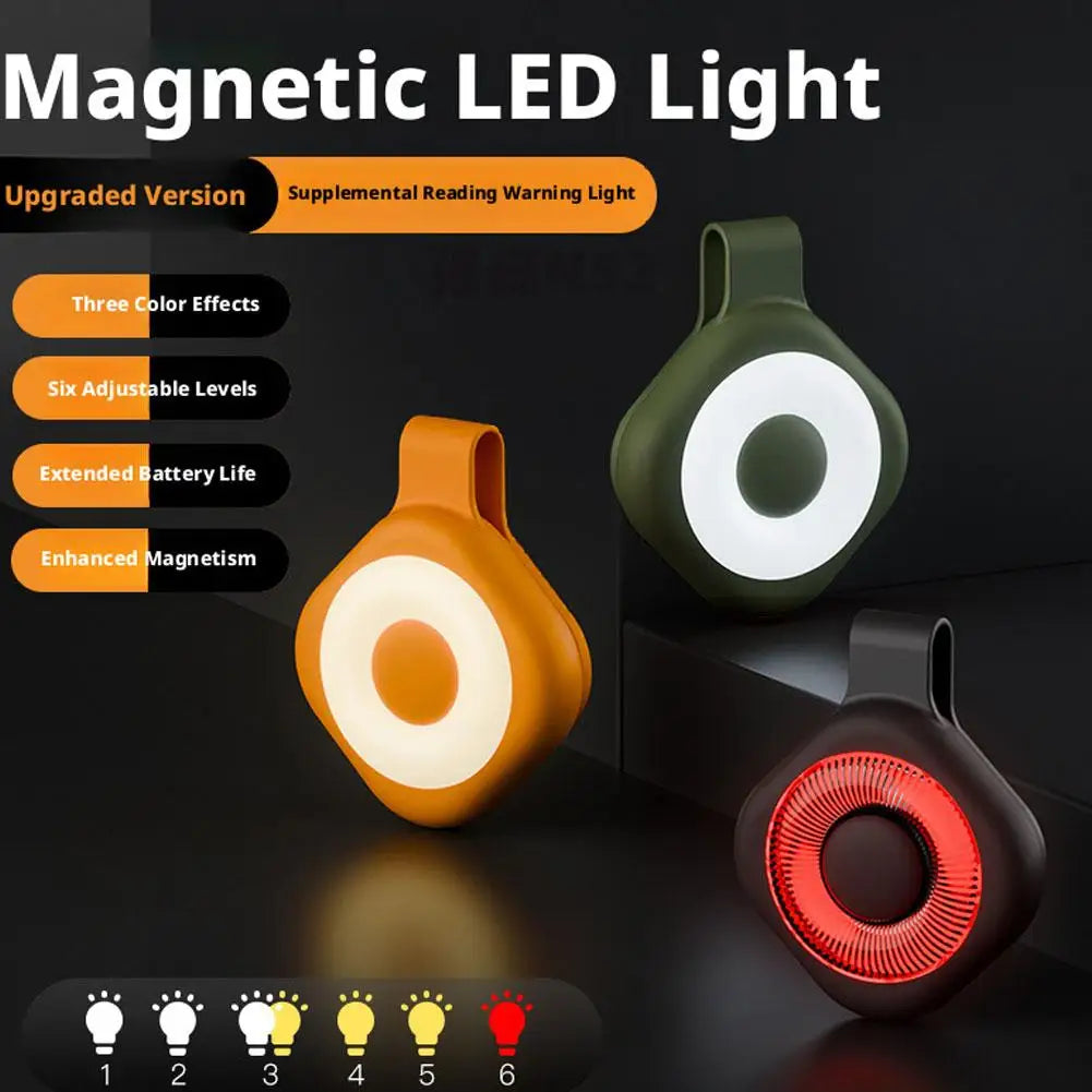 Magnetic LED ring light with orange and green housings, plus a red glowing unit