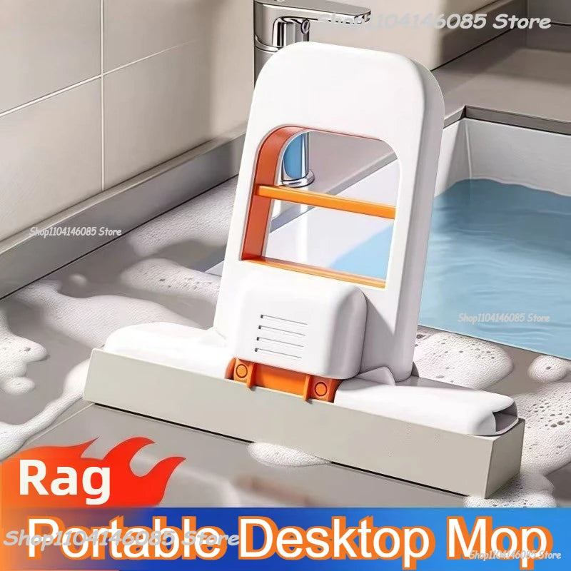 Portable desktop mop with orange insert and white frame on sink area for quick wiping