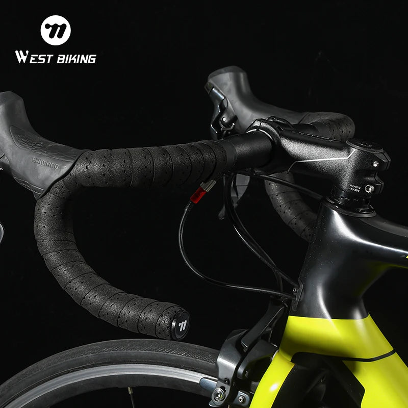 Black perforated bicycle handlebar tape installed on road bike handlebar grips