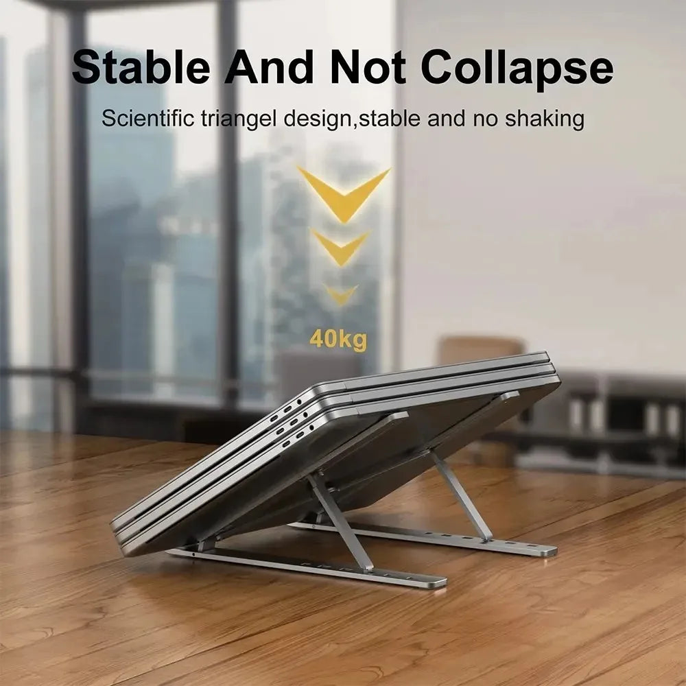 Aluminum laptop stand with wide triangular base and slotted rails, stable design.
