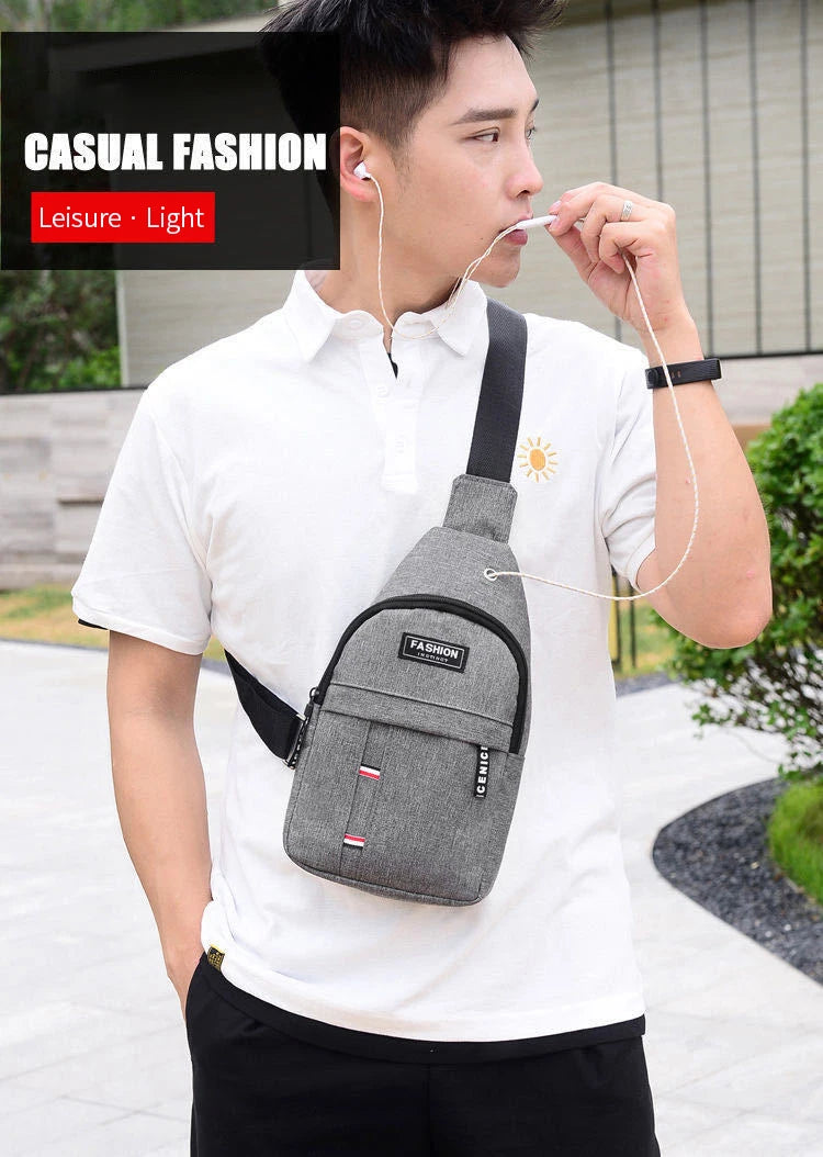 Gray crossbody sling fanny pack with adjustable strap, zip front pocket, and logo patch