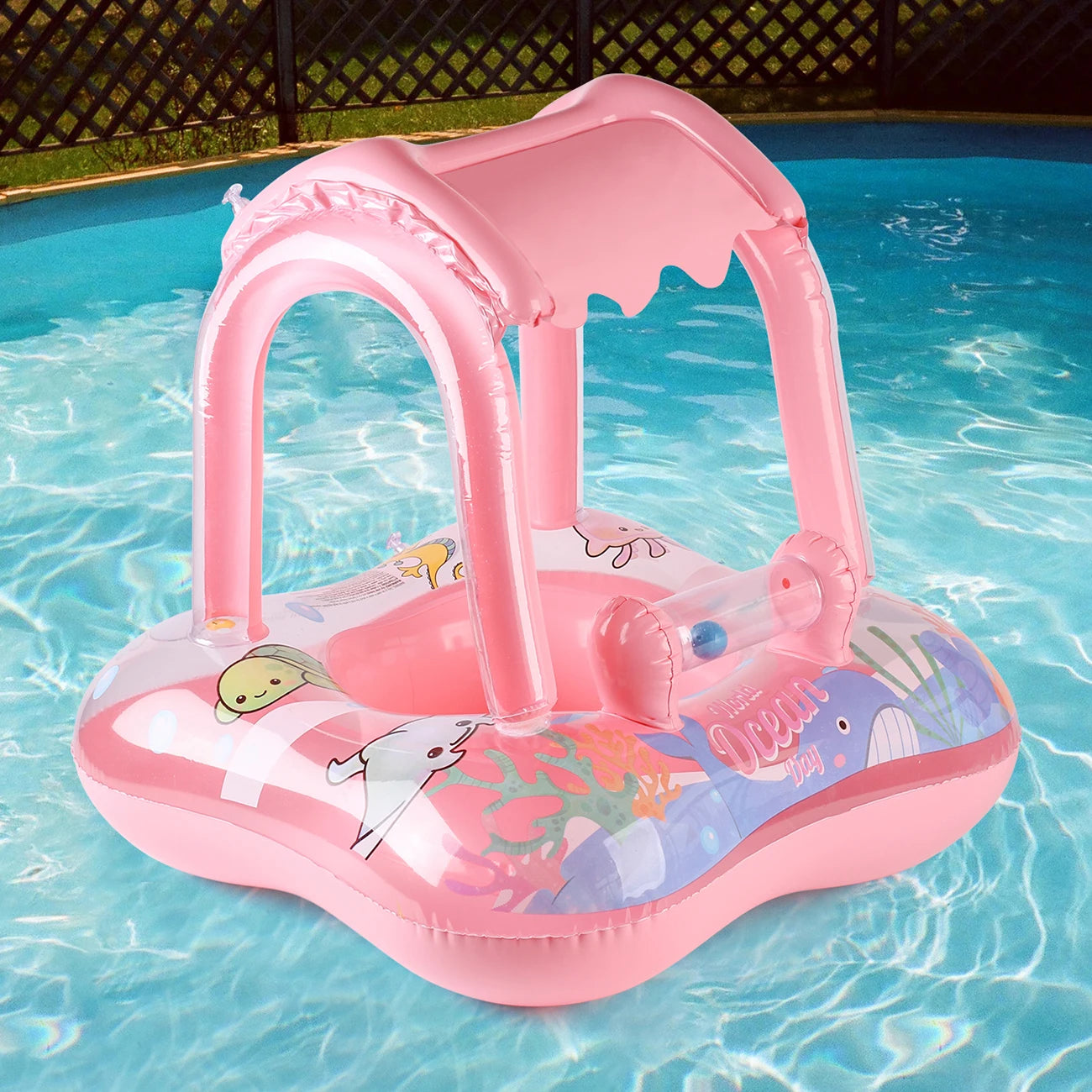 Pink inflatable pool float ring with canopy, cartoon sea animal print, and wide base
