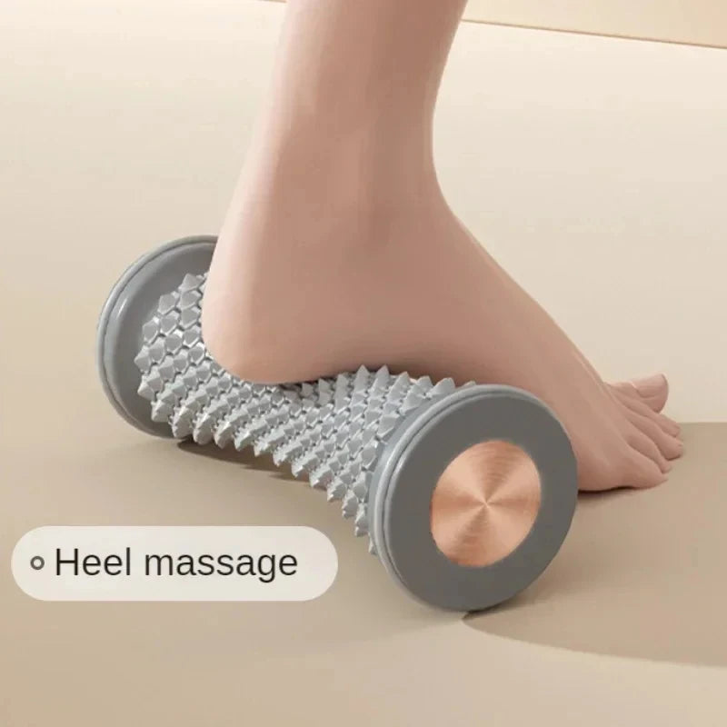 Gray foot massage roller for heel massage with honeycomb texture and wood-colored end