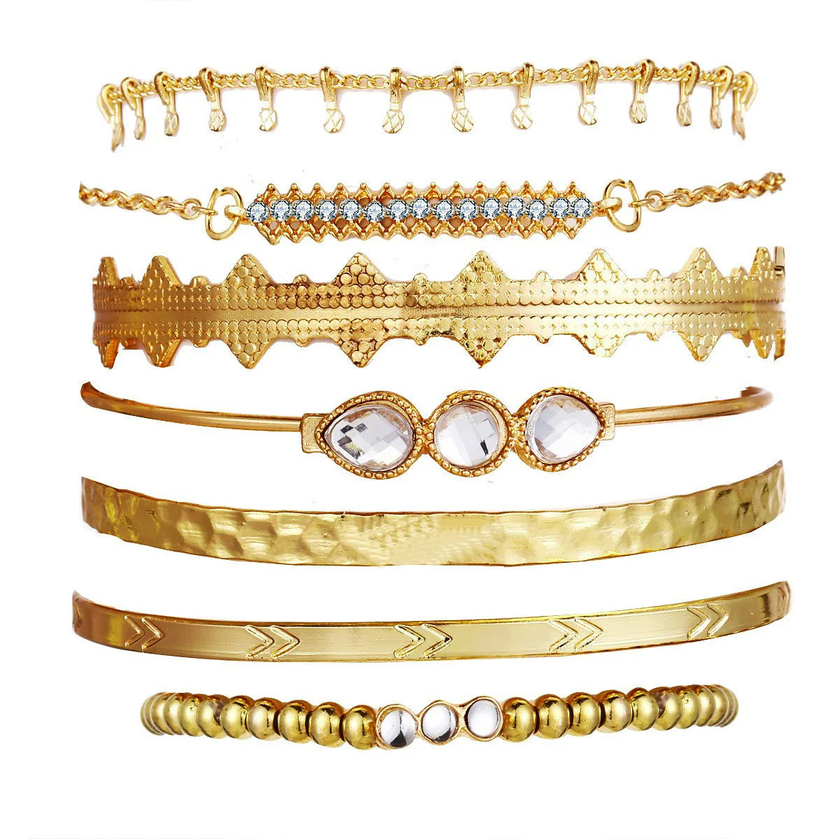 Gold-tone multi bracelet set with zigzag cuffs, fringe charms, and stone bangle
