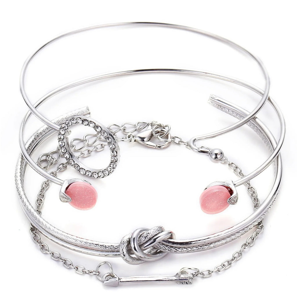 Silver-tone bracelet set with heart charm and pink bead accents