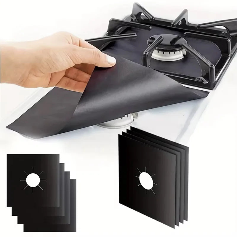 12-piece black stove protector liner set, folded pads placed over a gas burner