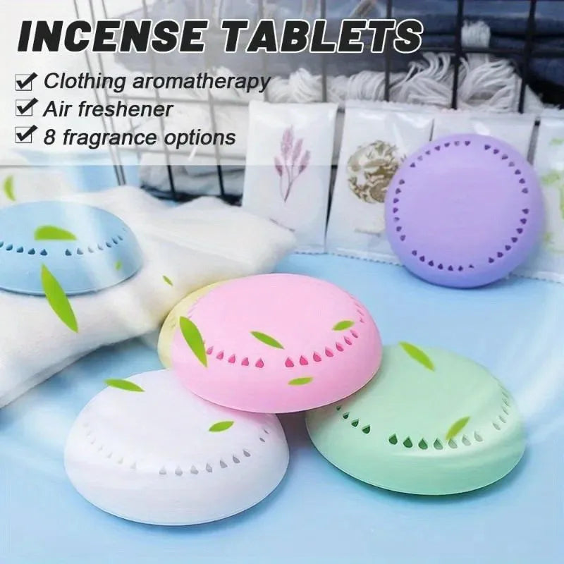 Set of three or four round aromatherapy deodorizing tablets in purple, pink, blue, and green