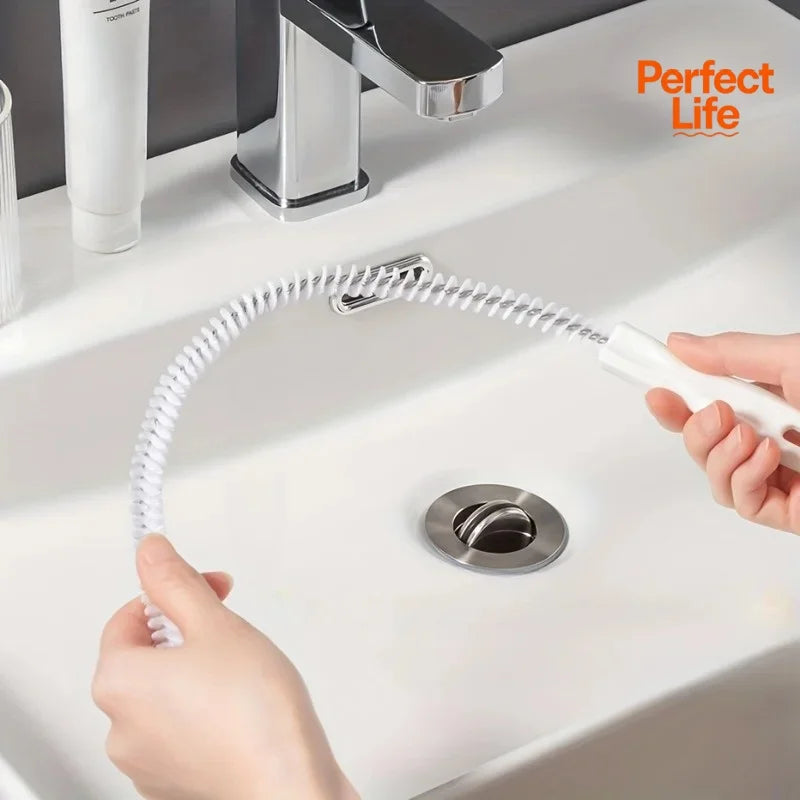 Flexible pipe hair cleaning brush with white handle and spiral bristles by sink drain