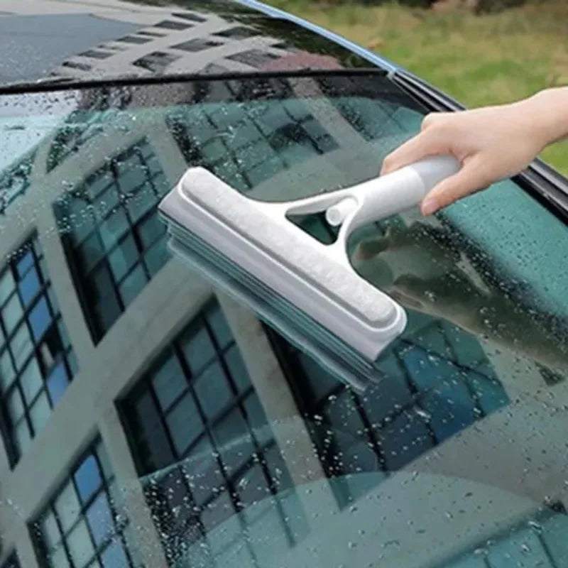 White-and-blue window squeegee wiper with rubber blade, cleaning car windshield