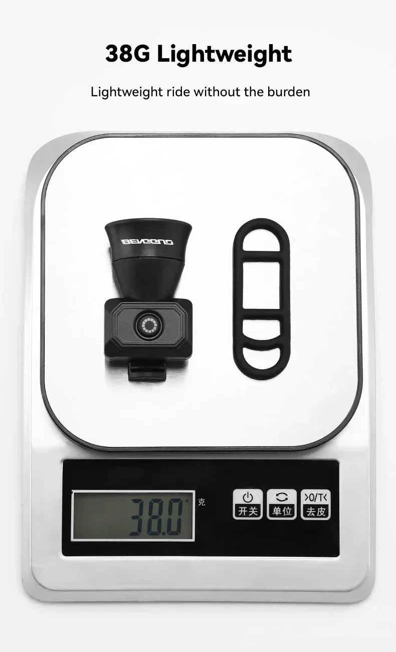 Black bike horn bell shown as 38g lightweight on a digital scale
