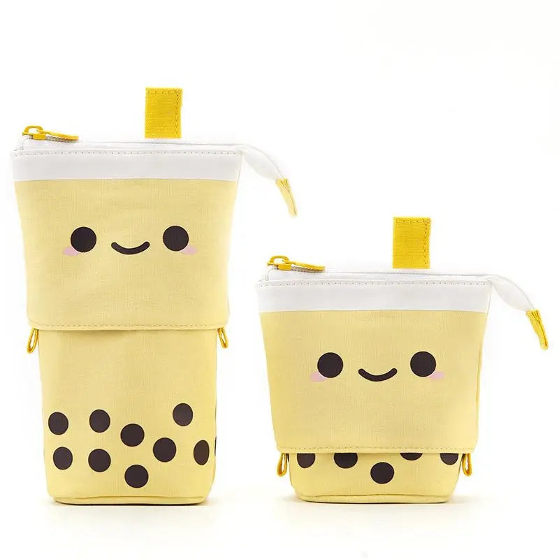 Canvas pencil pouch with zipper, yellow cat face with black polka-dot bottom.