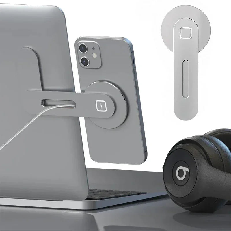 Magnetic slim phone holder with circular base and foldable arm, shown on a laptop edge