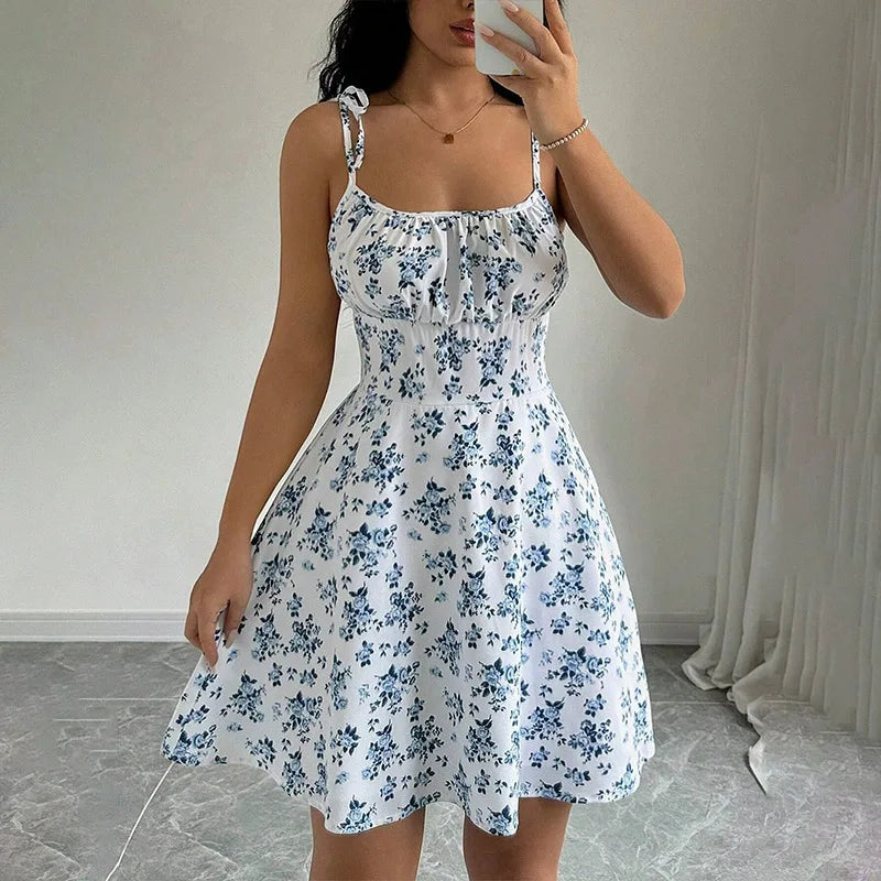 Blue floral spaghetti strap short dress with gathered bodice and twirly skirt