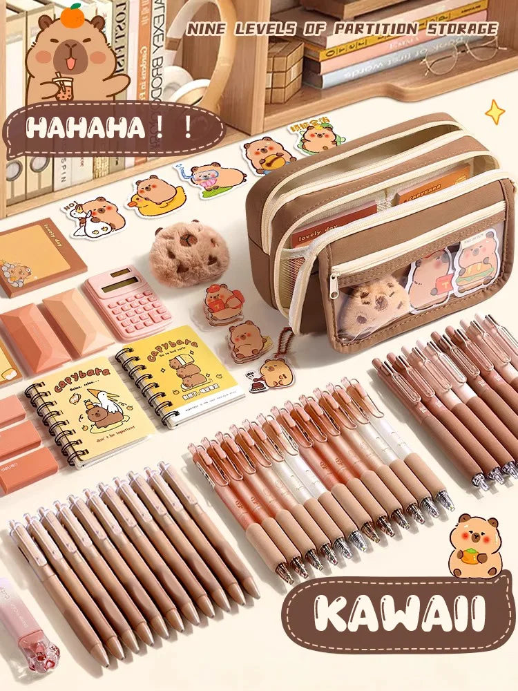 Beige and brown capybara pencil pouch with multiple compartments, pens and charms