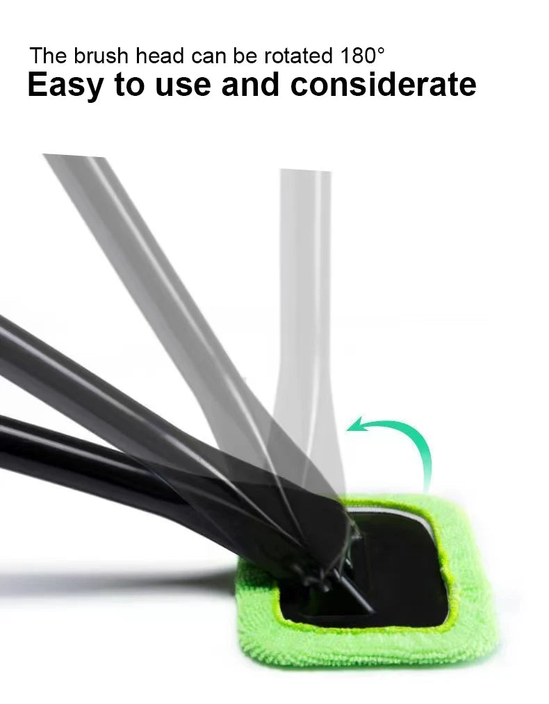 Car window cleaning brush with rotatable black head and green microfiber pad.
